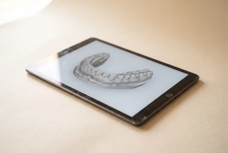 A tablet lying on warm off-white paper