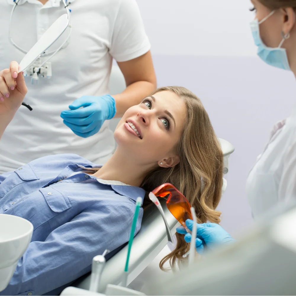 Relaxed patient discussing sedation dentistry options with dental professionals before treatment