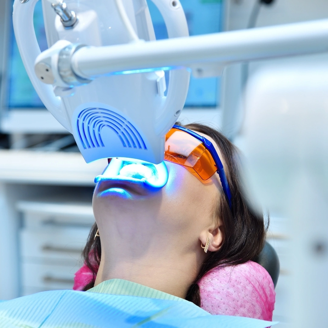 Patient undergoing Solea laser-assisted dental treatment with protective eyewear in modern clinic