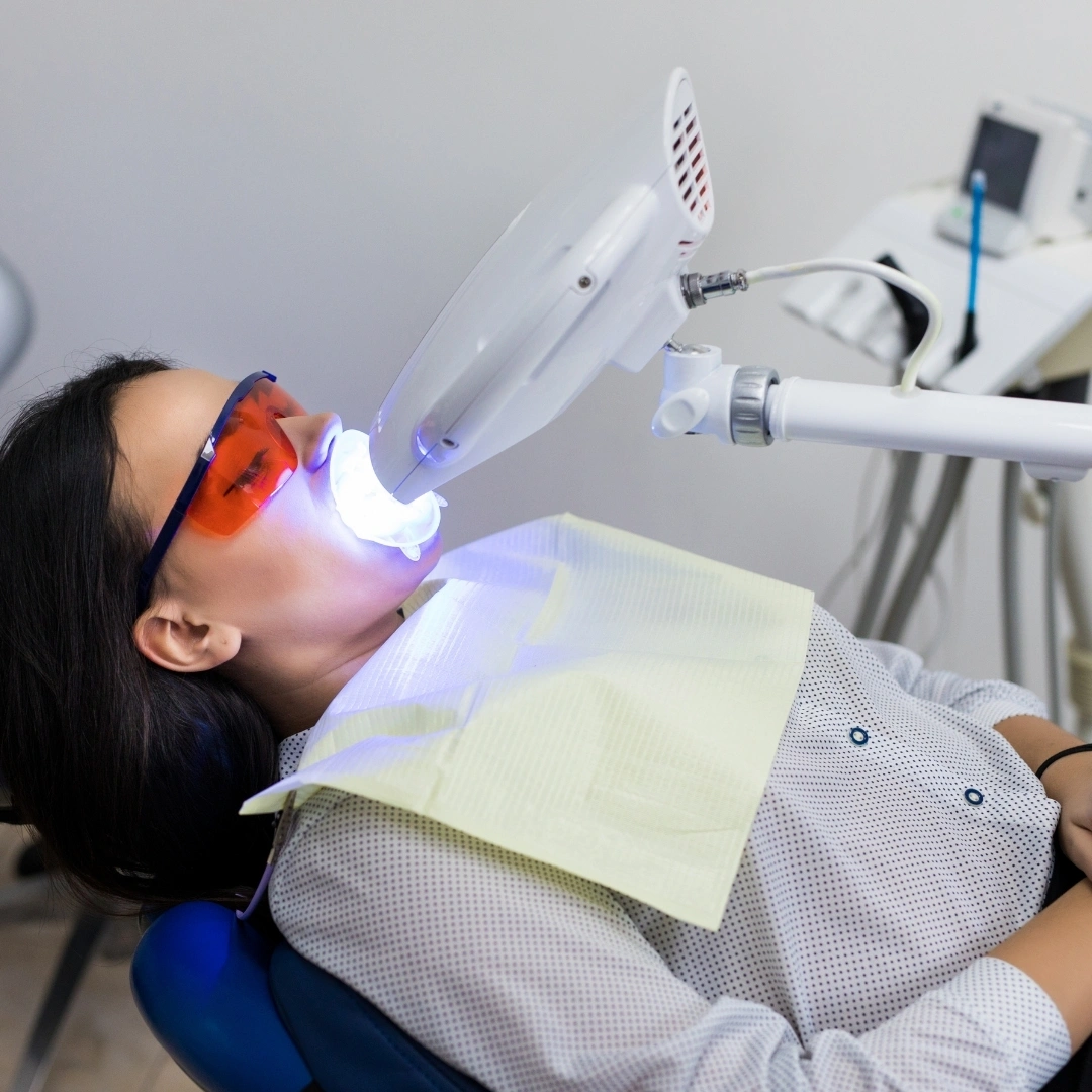 Patient relaxing during Solea laser dental procedure with advanced laser equipment and eye protection