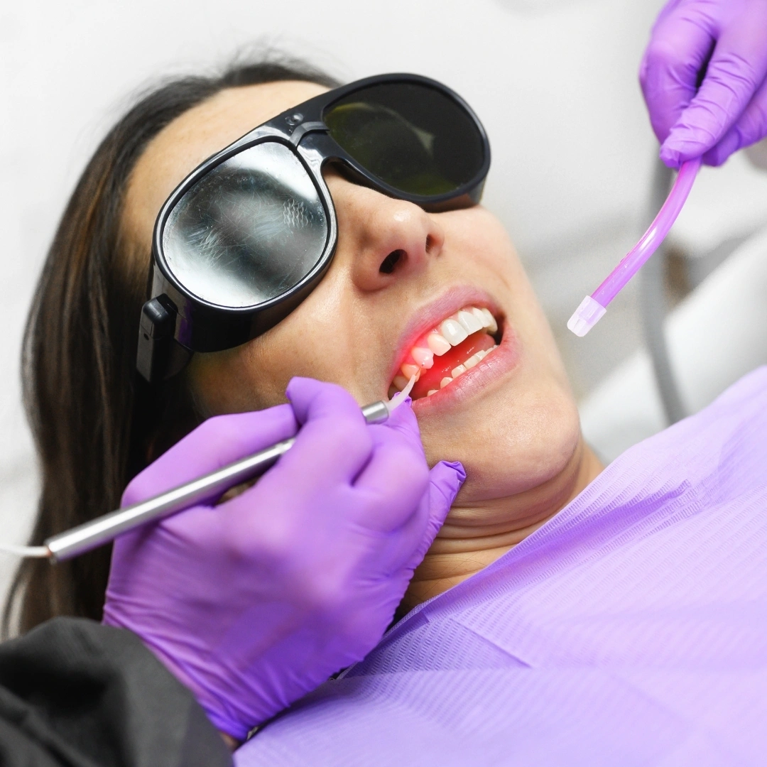 Patient receiving Solea laser dental treatment with protective glasses and advanced laser technology